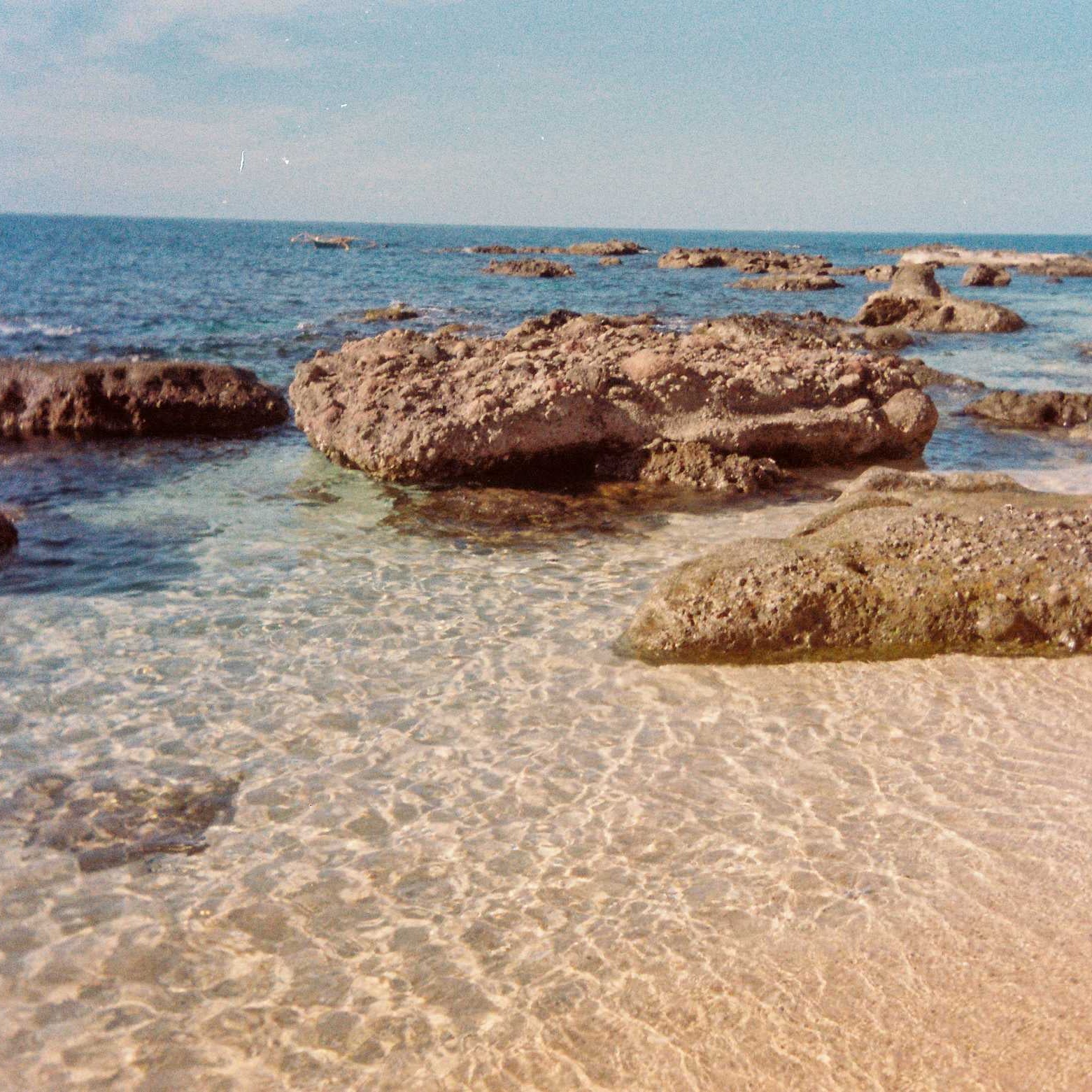 Beach in the Philippines with clear water and a blue sky